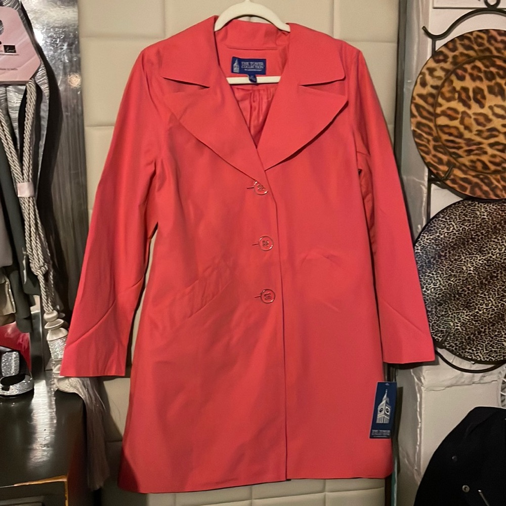 London fog, single breasted trenchcoat with pleated back.